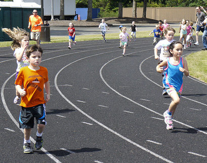 Preschool girl running fast and play catch-up and tag game